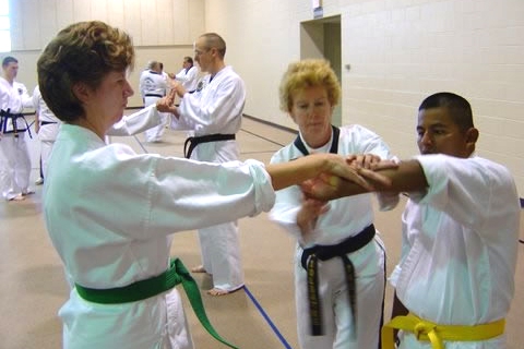 Ms. Soldalke assisting two students at the 2007 Sioux Falls Clinic